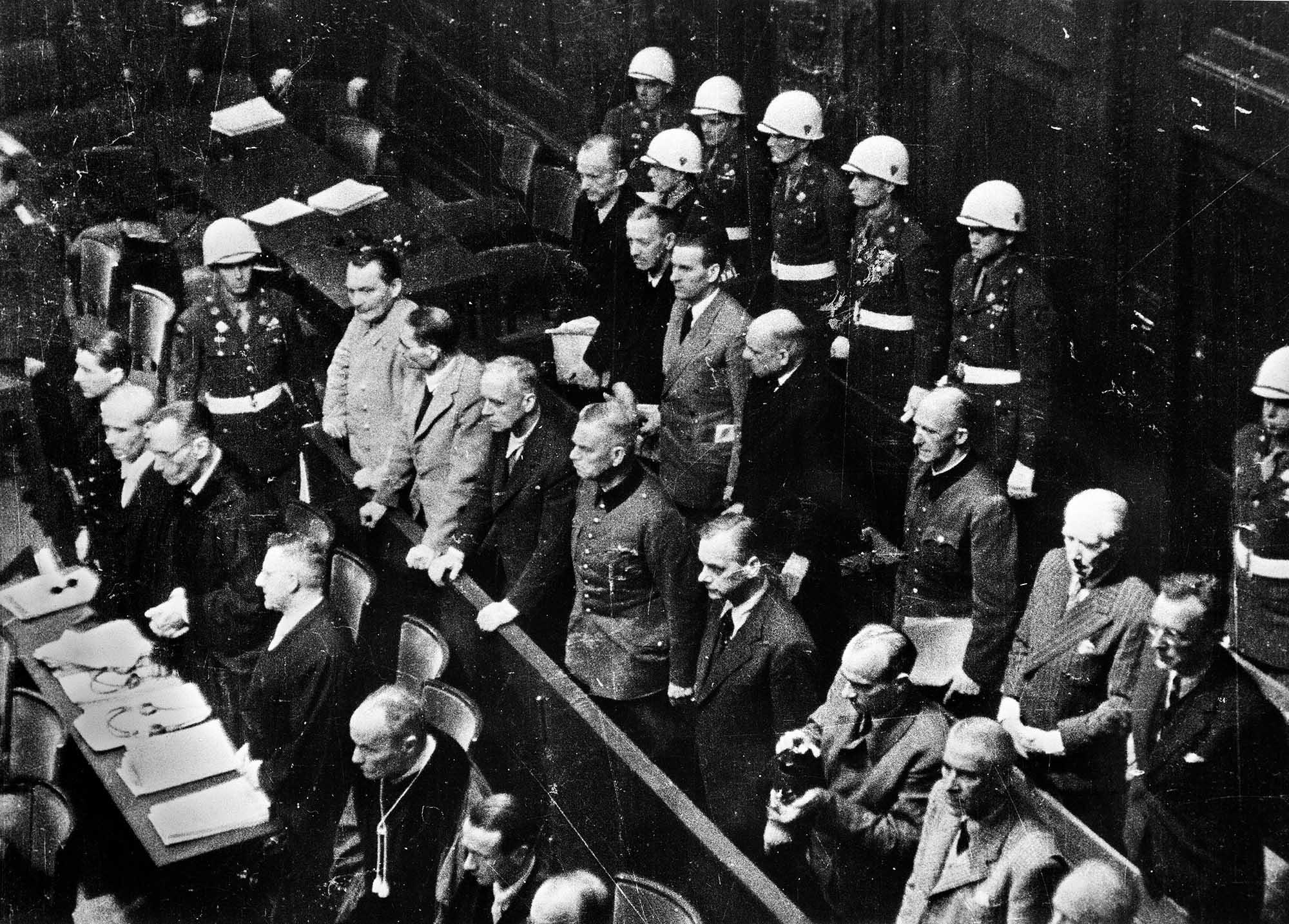German major war criminals at the verdict of the Nuremberg Trials, October 1, 1946. Pictured in the front and back rows are leading Nazi officials, among them Hermann Göring, Rudolf Hess, and Karl Dönitz.