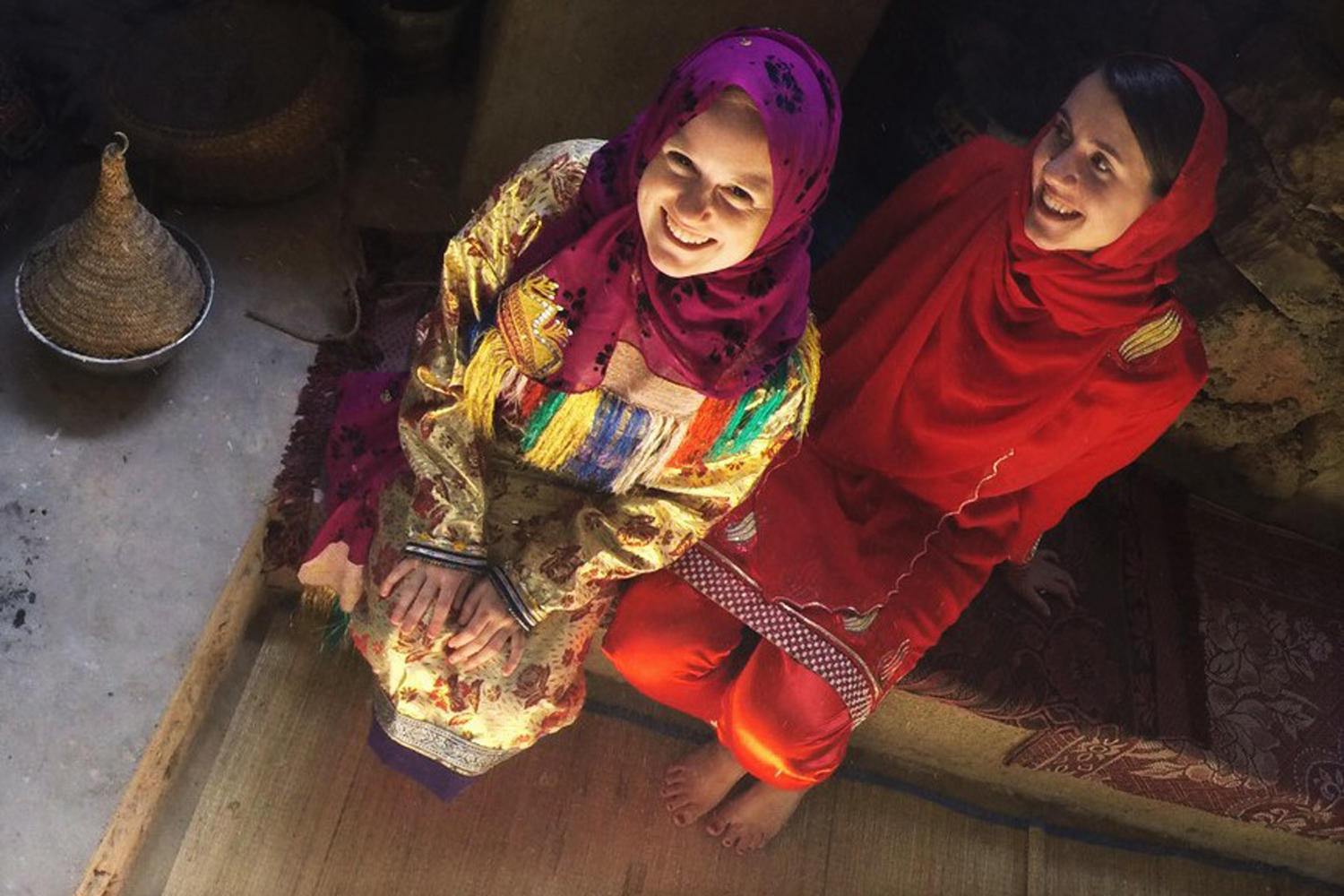 Salome Bader (left) in traditional Omani dress.