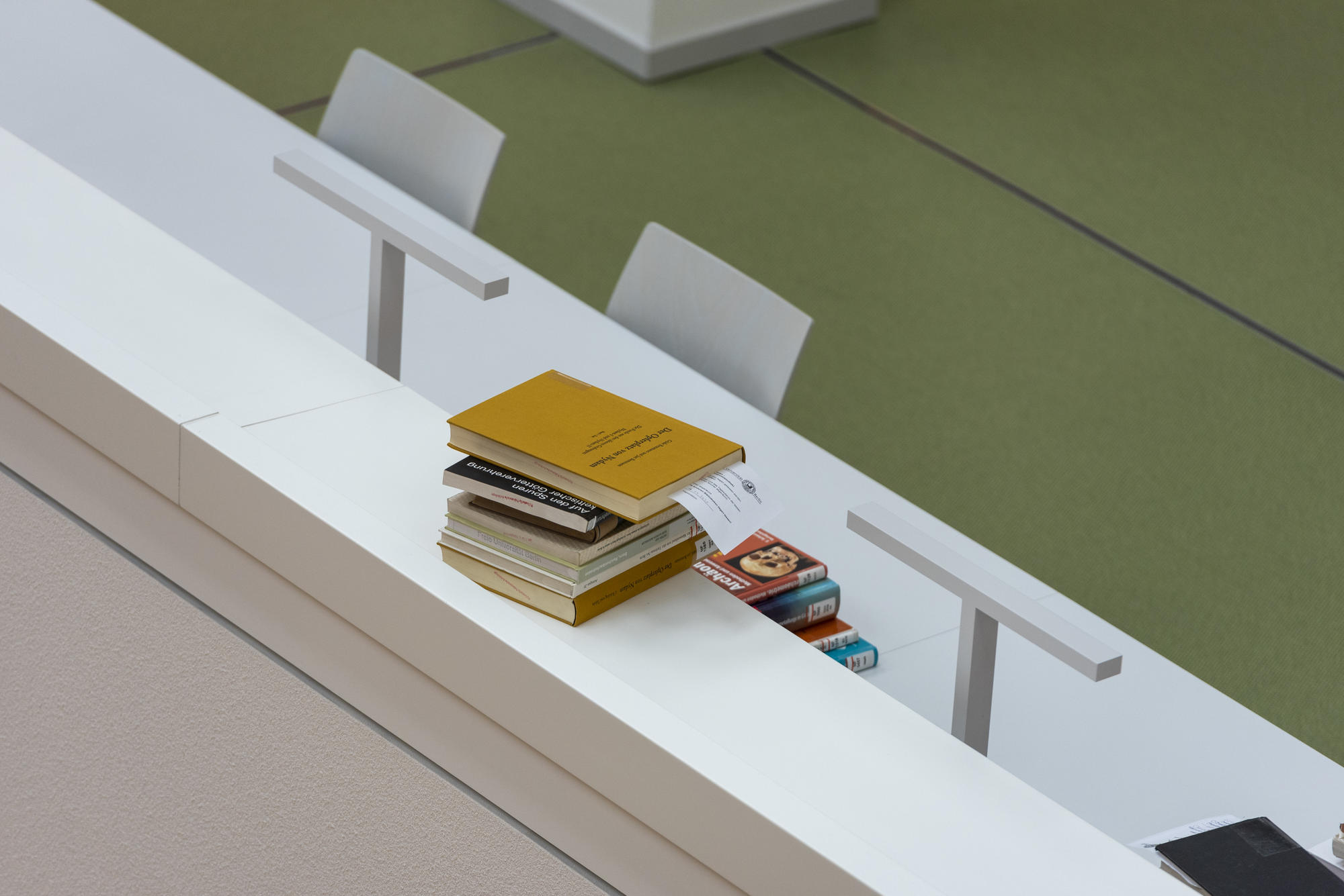 A stack of books at the Campus Library